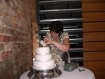 A picture our cake designer setting up a wedding cake at a local wedding venue.