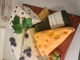 various cheese shapes on birthday cake 