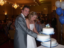 The Bride and Groom cutting thier wedding cake 