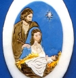 A hand painted Christmas cake decoration of mary and Joseph