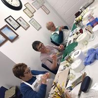 a group of sugarcrafters making models at a workshop 